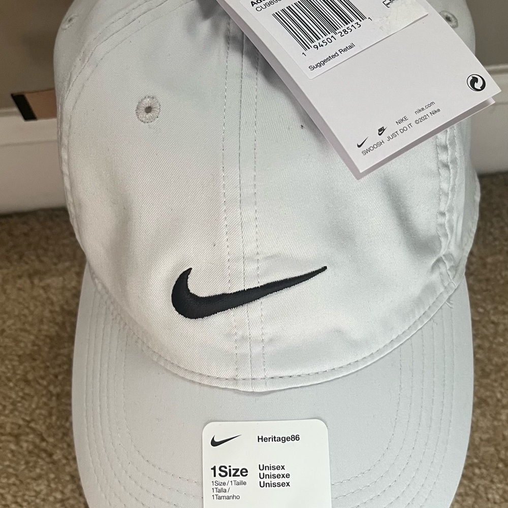 Brand new Light Grey Nike hat. Hey can be worn anytime day or night.